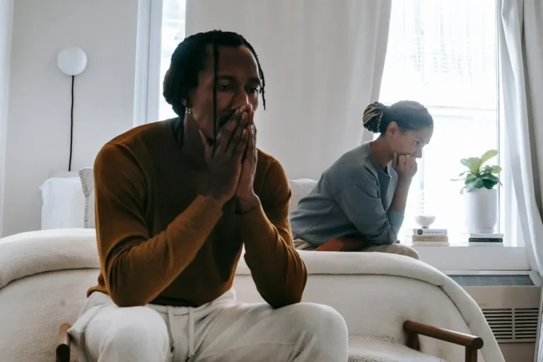 distressed man next to woman