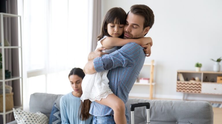 little girl upset that father is leaving