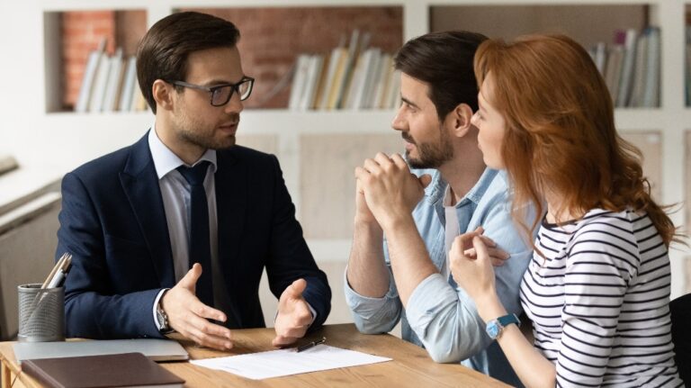 young couple is consulting with lawyer