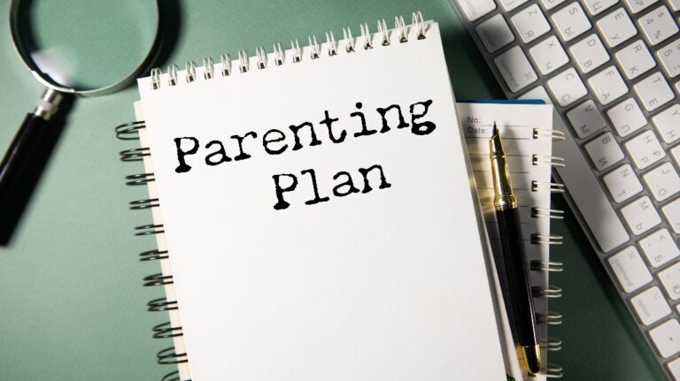 Parenting Plan is written on a notebook