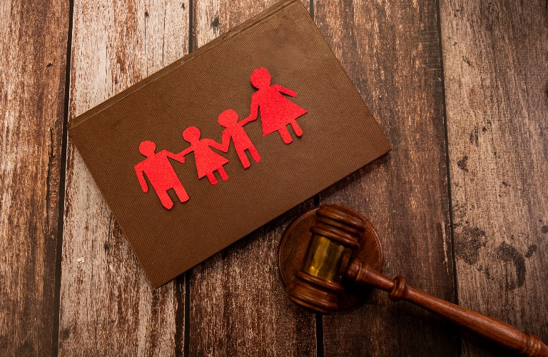 paper family figures and judge's gavel